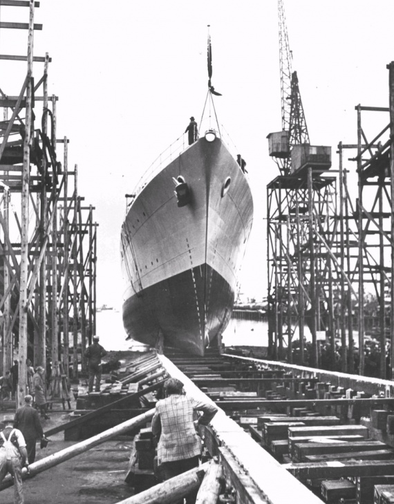HMAS Anzac sliding down the slipway after being launched