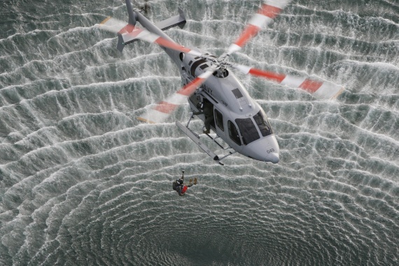 A Bell 429 helicopter of 723 Squadron displays winching exercises during a Navy helicopter display in Sydney Harbour.