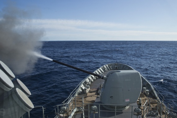 HMAS Stuart fires the Mark 45 Mod II five-inch gun towards a target at Beecroft Weapons Range.