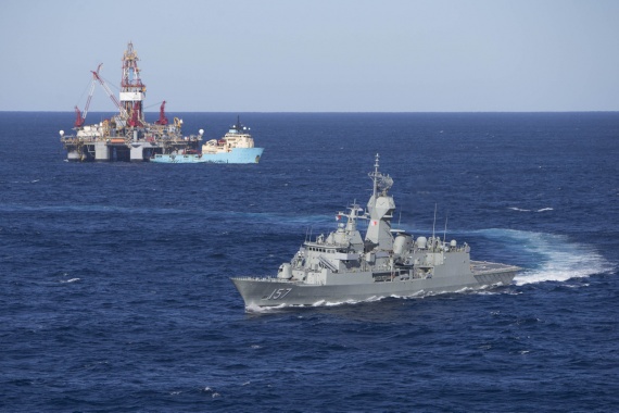 HMAS Perth sails through the oil rigs located in the North West Shelf off the coast of Western Australia.