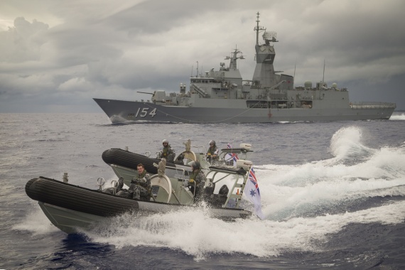 HMAS Parramatta's seaboats speed away from the ship in the waters of Yap, Micronesia.