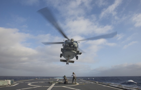 ABATV Michael Pearse (left) and ABATA Benjamin Clark conduct a RAST recovery assist with HMAS Warramunga’s embarked MH-60R helicopter during the ships deployment to Operation MANITOU.