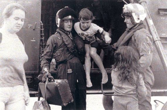 HT725 Squadron personnel assist evacuees out of a Wessex helicopter during the Nowra floods in 1974.