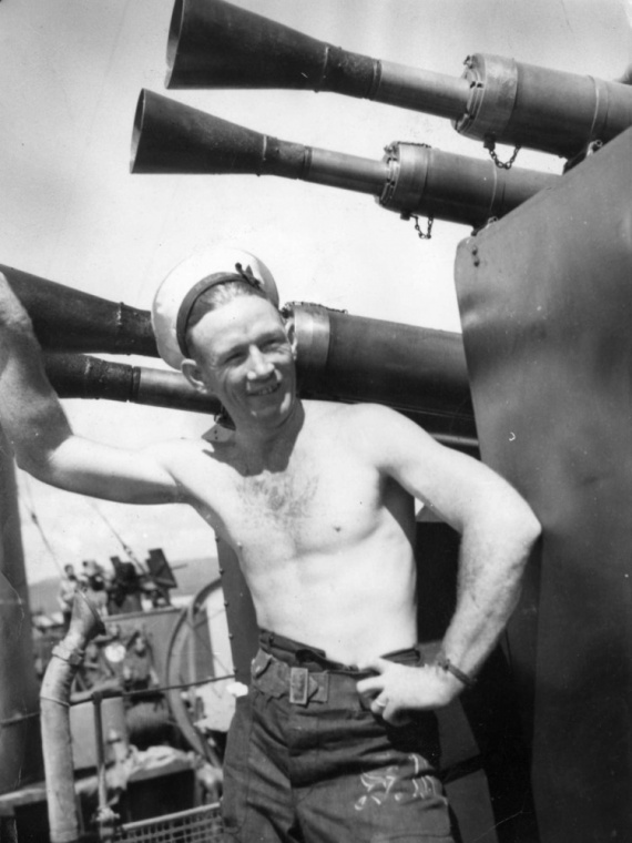 Able Seaman S, Redfern on watch by HMAS Warramunga's Pom Poms.