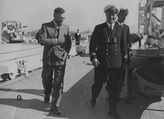 Pioneer aviator and yachtsman Francis Chichester confers with Lieutenant GL Cant, RAN during a visit to Albatross following his history making first solo flight across the Tasman Sea from East to West (New Zealand-Australia), circa 1931.