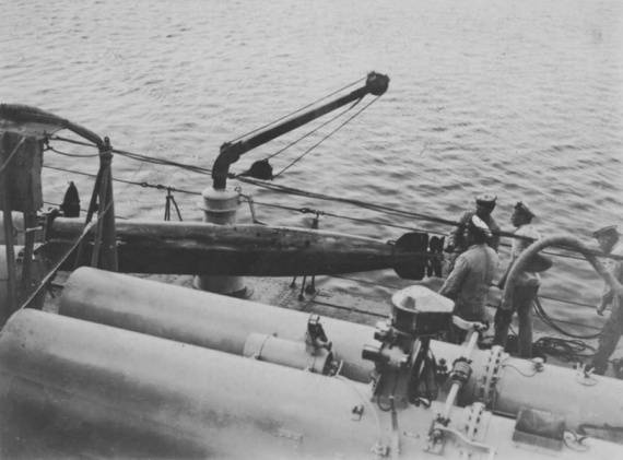 Loading HMAS Tasmania's 21-inch torpedos.