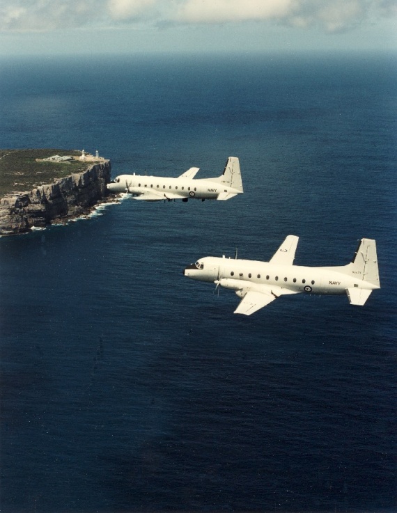 The RAN's two HS748s in flight over Point Perpendicular, Jervis Bay.