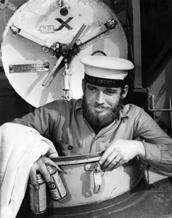 Leading Seaman W.G. Keegan, comes up from below decks as HMAS Arunta arrives in Melbourne, September 1943