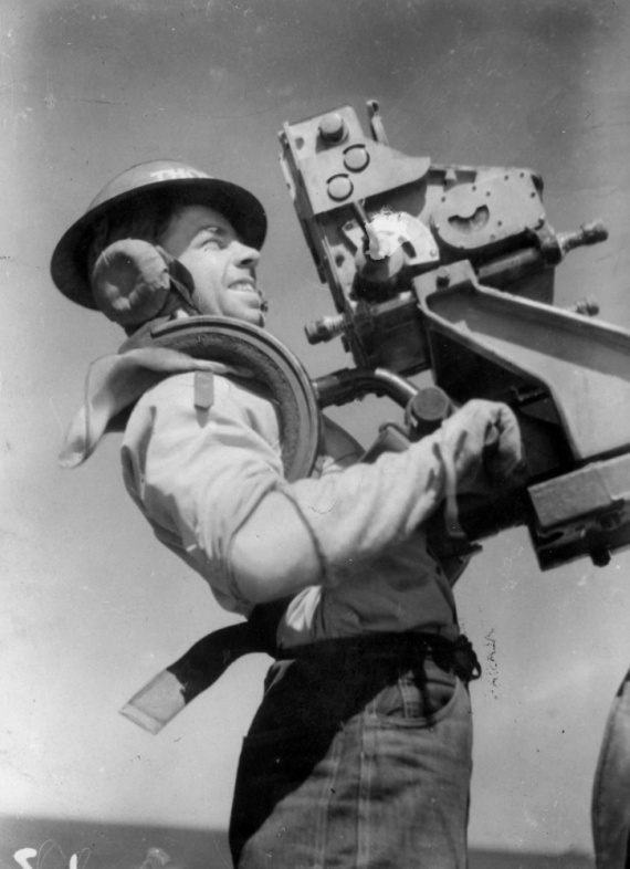 Able Seaman W. Thompson firing an oerlikon onboard HMAS Warramunga.