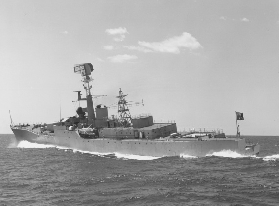 HMAS Stuart (II) undergoing sea trials, circa 1963. Note the red ensign flying from her quarterdeck.