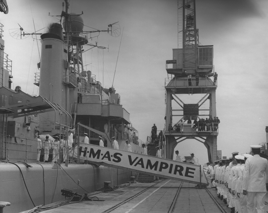 Vampire's ship's company boarding the ship following her recommissioning at Dockyard Pier, Williamstown