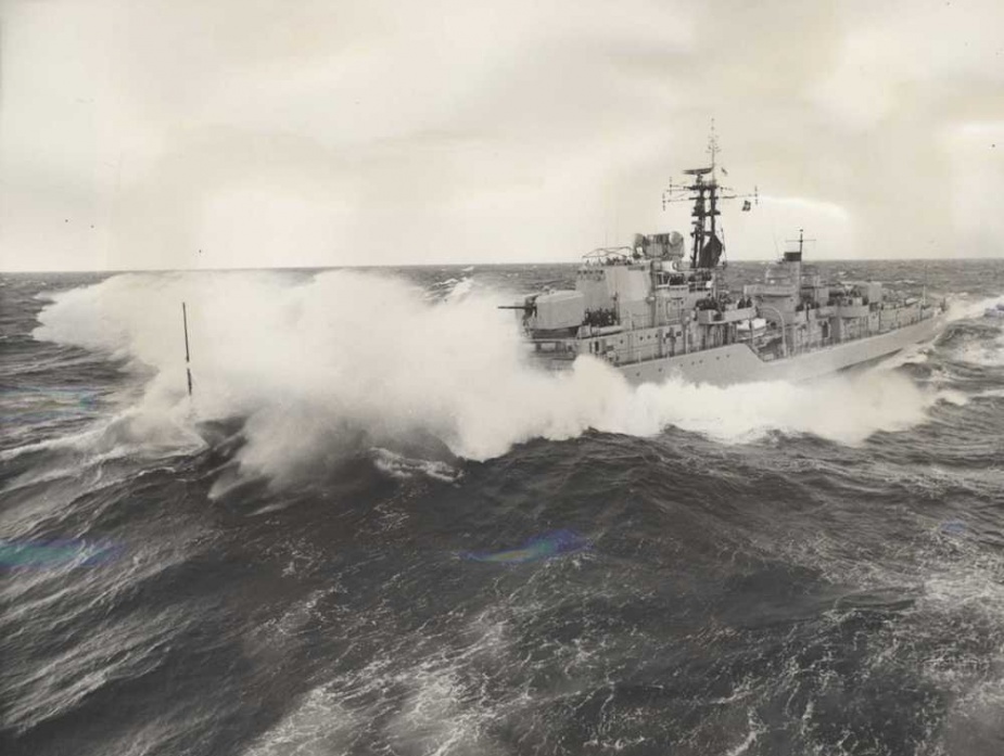 HMAS Vampire in large swell as she approaches HMAS Melbourne, 1966