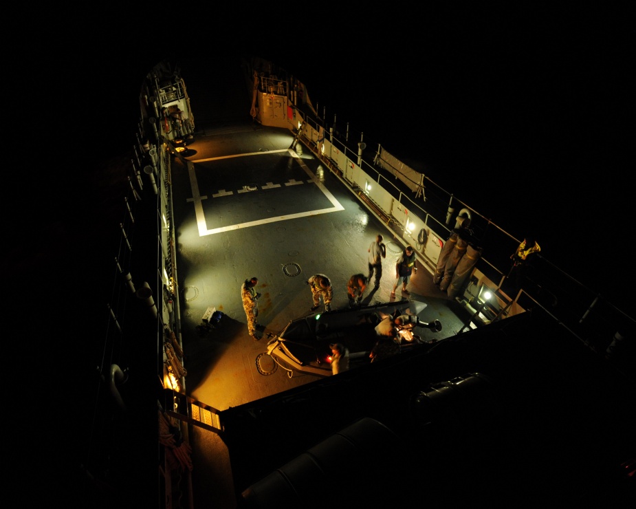 HMAS WEWAK's crew prepare the zodiac for night boat evolutions, in the Solomon Islands during Operation ANODE, 2010