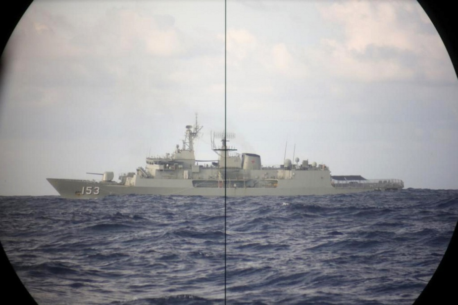 Anzac class frigate, HMAS Stuart, is observed through periscope on board the Collins class submarine, HMAS Sheean, during a routine transit and training exercise off Christmas Island.