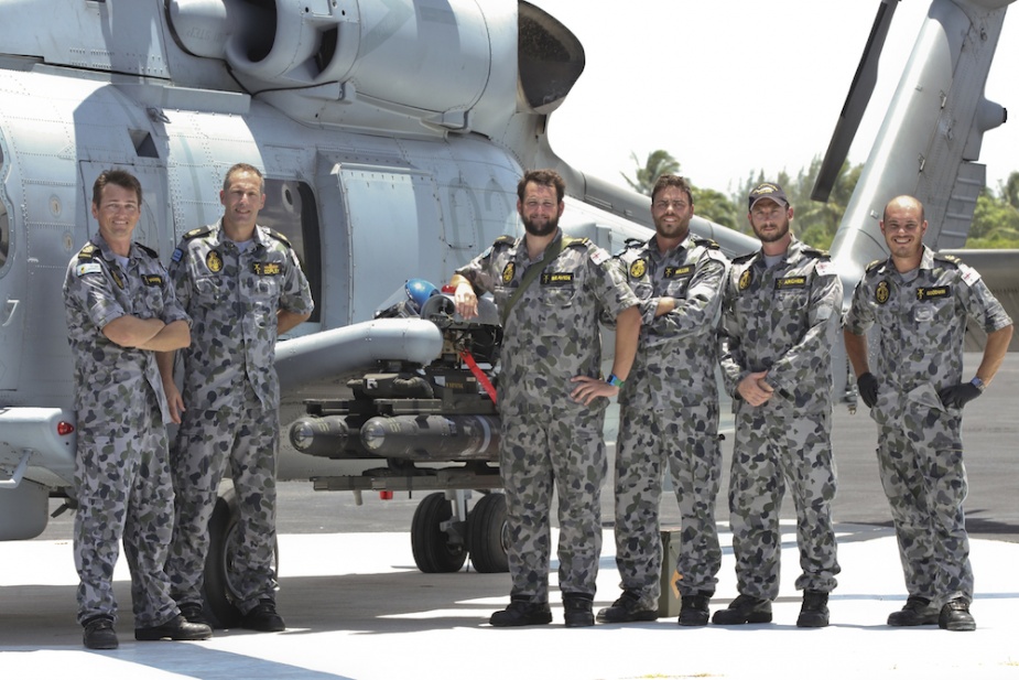 Members from NUSQN 725 fit the first 'Hellfire' missile to be fired from the MH-60R Seahawk 'Romeo', in Florida, United States of America.   (from left) Petty Officer Aircraft Technician Avionics (ATV) Ray Warren, Chief Petty Officer ATV Phil Copley, Able Seaman (AB) ATV Josh Beaven, ABATV Josh Miller, Leading Seaman (LS) ATV Gian Archer, LSATV Mark Goodwin.