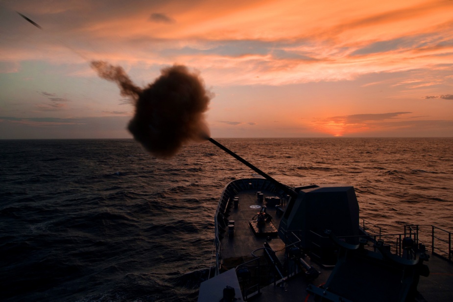 HMAS Parramatta fires a round from their 5-inch, Mk45 gun off the east coast of Australia.