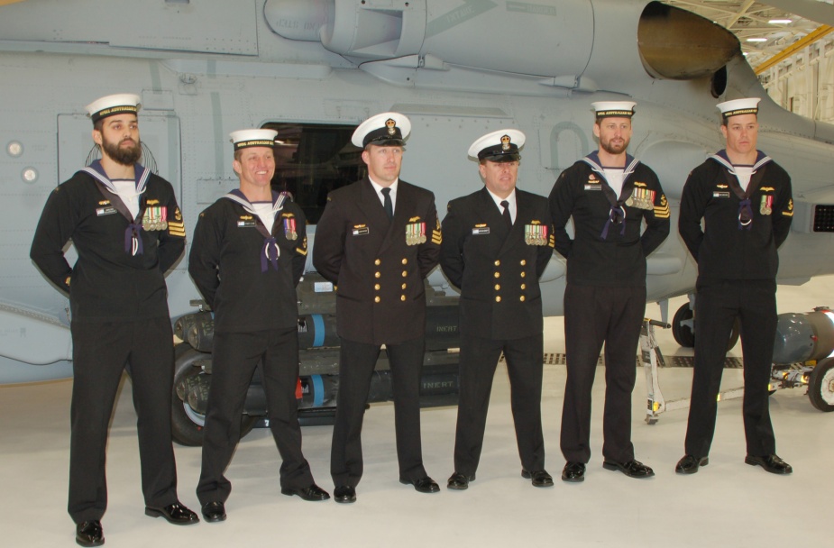 NUSQN 725 members (left to right) LS Eammon O’Brien, LS Tom Clunie, PO Glenn Watson, PO Nathan Minett, LS Chris Hodgkinson and LS Liam Carruthers standing by the RAN’s No. 2 Romeo at the ‘In Service Date’ ceremony in Hangar 1122 24 January 2014. (Photo courtesy Jax Air News)