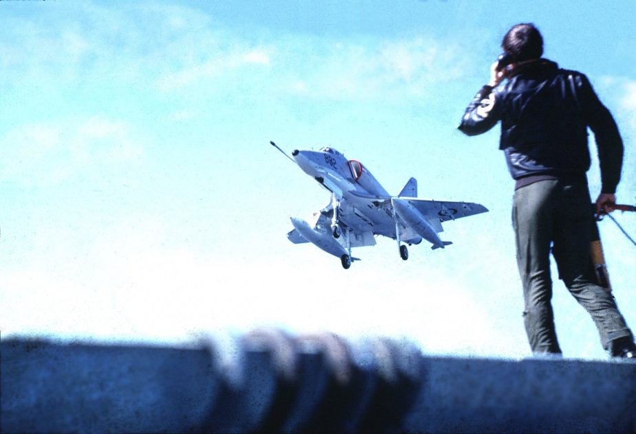 A Skyhawk coming over Melbourne's round-down. In the foreground is the Landing Signal Officer, Lieutenant Peter James. Photo courtesy Lieutenant Commander J Brown.