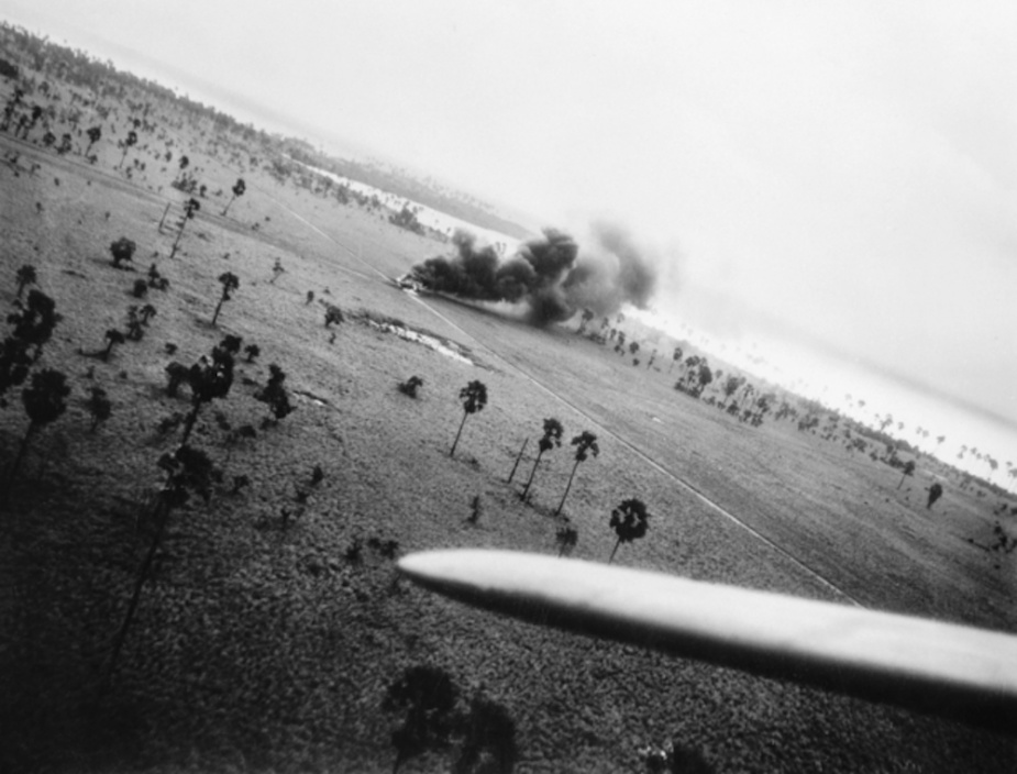 A burning Japanese aircraft following the Beaufighter attack on Selaru (AWM PO1157.007)