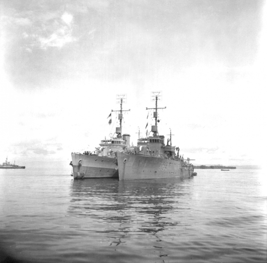 HMAS Townsville (J205) and HMAS Bunbury (J241) lying at anchor in the Morotai Area, c. June 1945 (AWM 109368).
