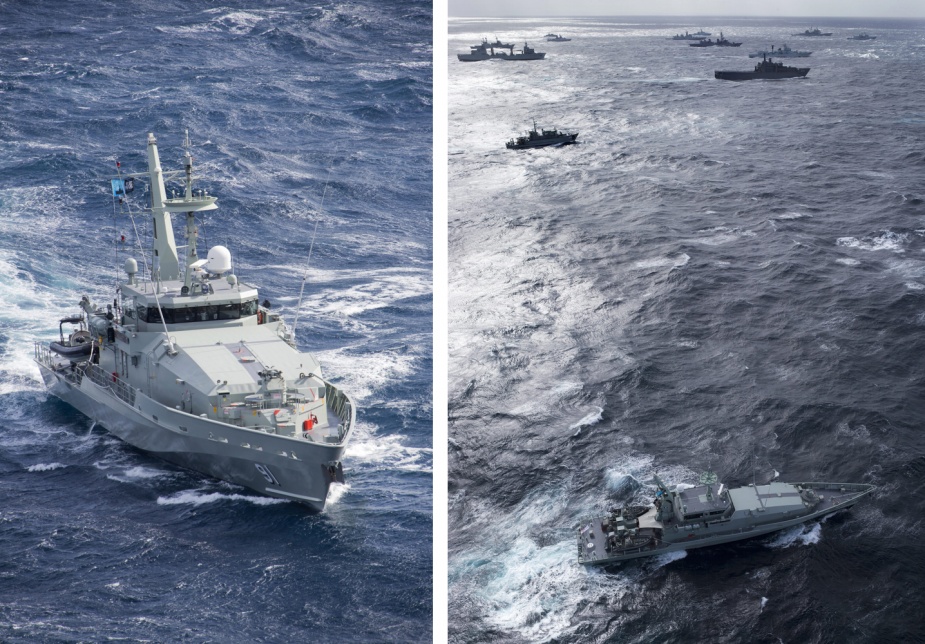 HMAS Bundaberg at sea, with a multi-national fleet of ships participating in the International Fleet Review, sail in formation in the Eastern Australian Exercise Area off the coast of Jervis Bay.