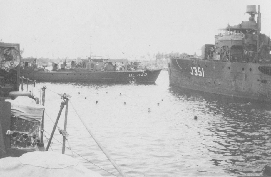 HMAS Cowra in company with ML325 during a lighter moment in waters off Madang when permission was given for 'hands to bathe'.