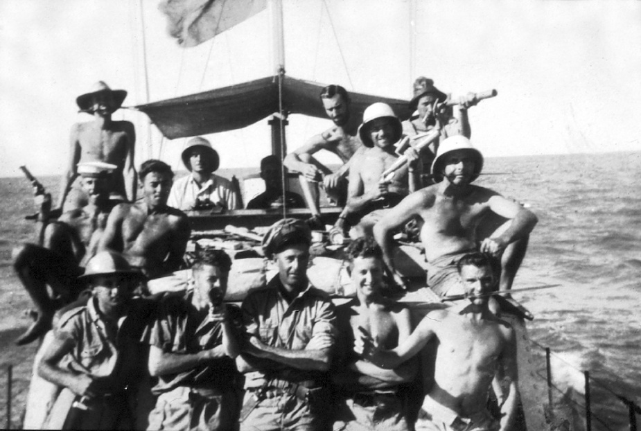 ML 814's crew looking more like pirates in the Gulf of Carpentaria. Top row, L-R: D Kelly, R Lewis, D Kay, J Nelson, J Old, R Hayes. Middle row: R Ling, T Trewick, J Livingstone. Front row: MC Hordern, Brewer, Chips Wood, D Partridge, G Constable.