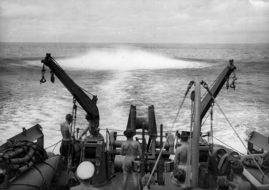 A depth charge exploding in the ship's wake