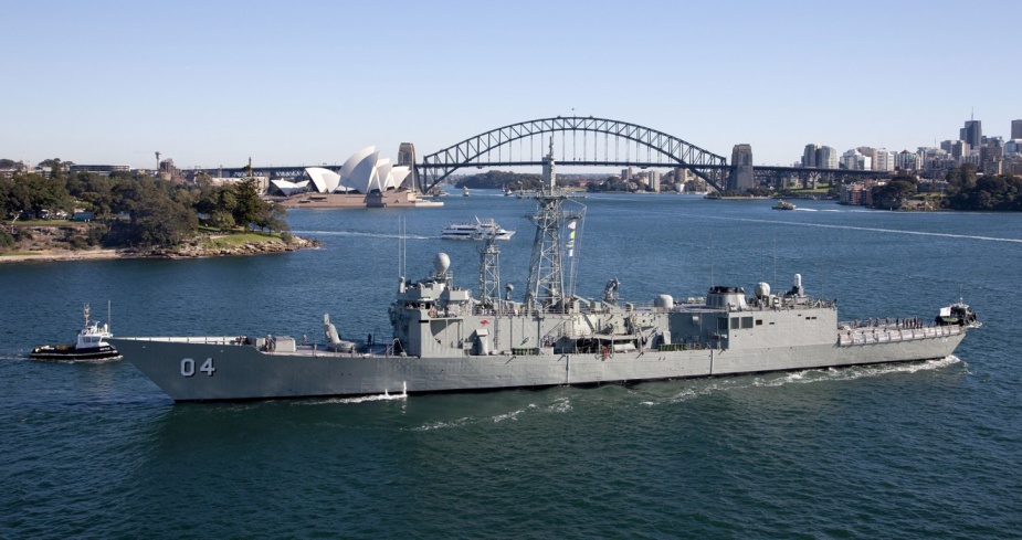 HMAS Darwin leaves stern first from Garden Island Naval Base, Sydney, under control of tugs, 29 July 2013.