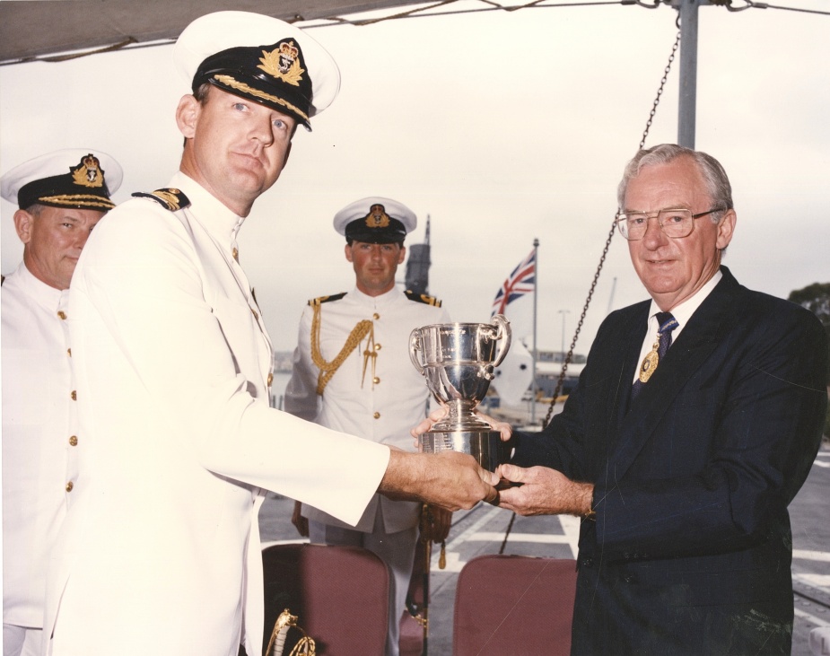 CMDR M Bell, RAN accepts the award of the Duke of Gloucester Cup from the Governor-General the Honourable Bill Hayden, on behalf of HMAS Darwin's ship's company in 1995