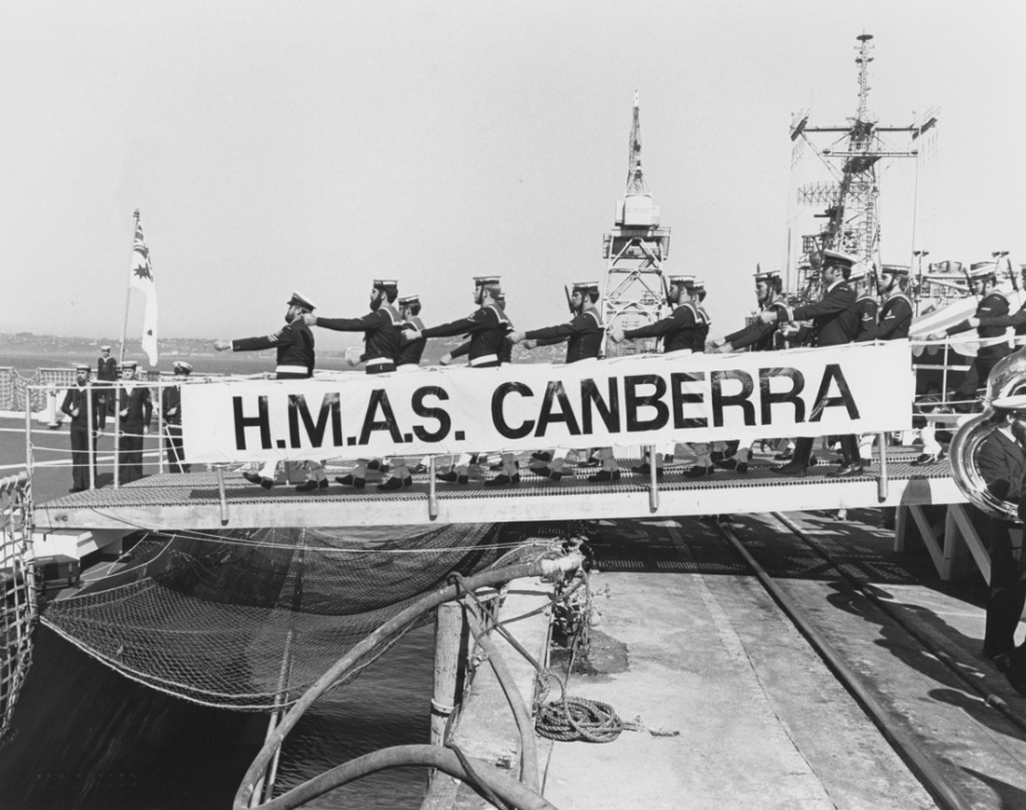 HMAS Canberra's crew march on board following her commissioning, 21 March 1981.