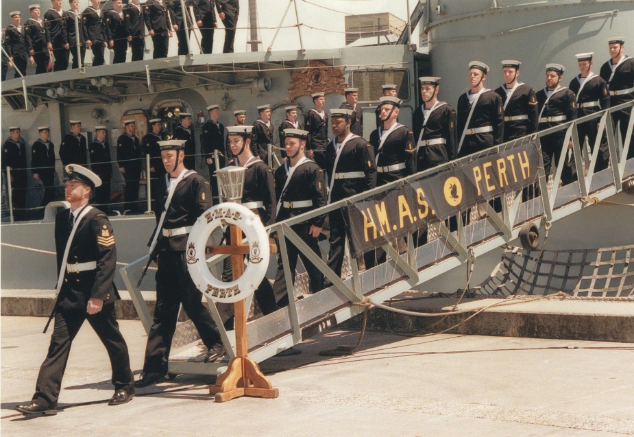 HMAS Perth's ship's company ceremoniously leaving the ship for the last time