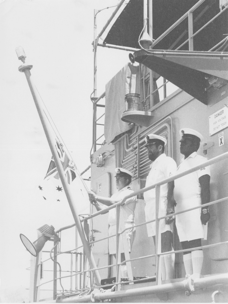 Australian White Ensign is lowered on HMAS Salamaua for the last time by its Commanding Officer, Lieutenant W.K. Scott. A few minutes later the Papua New Guinea Ensign was flying as the Landing Craft Heavy was re-commissioned into the Maritime Element of the Papua New Guinea Defence Force.