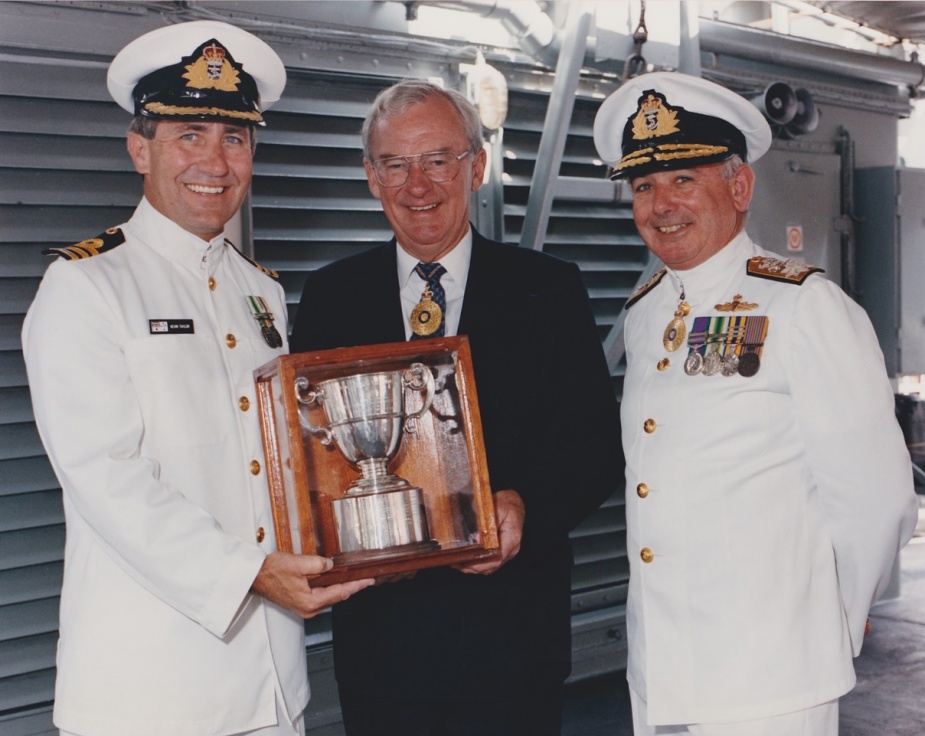 Commander KB Taylor, CSC, RAN accepts the Duke of Gloucester Cup on behalf of HMAS Tobruk's ship's company in 1993. Rear Admiral D. Chalmers, RAN looks on.