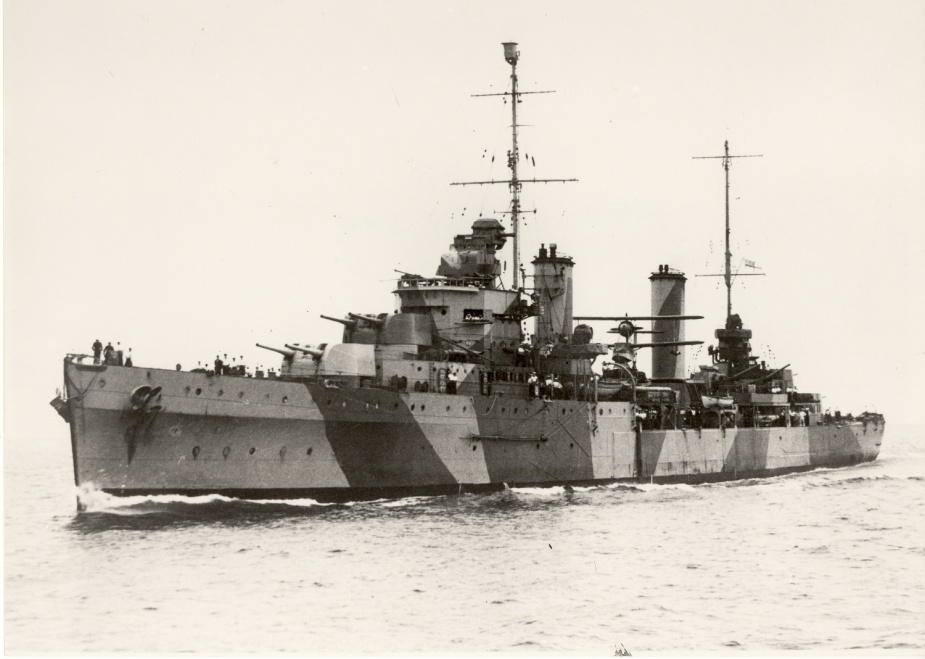 Following the Cape Spada action Sydney received her first disruptive camouflage paint scheme. 3/8-inch protective steel plate was also fitted around her 4-inch gun deck.