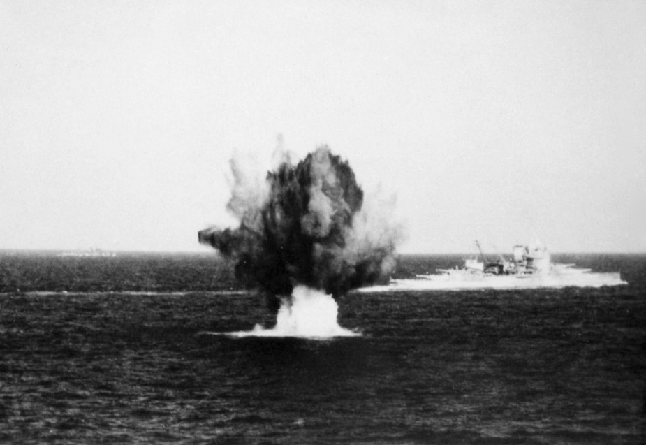 HMS Warspite under fire in the Mediterranean.