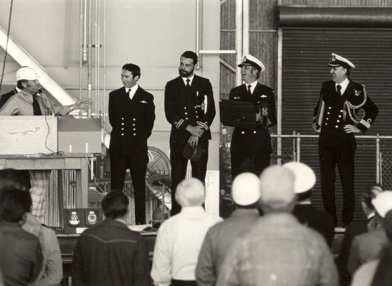 LCDR Jack McCaffrie, LEUT Jack Ryan, CMDR Rob Partington and CDRE Robert Loosli at the handover ceremony of replacement Trackers in the USA in 1977 following the hangar fire at NAS Nowra.