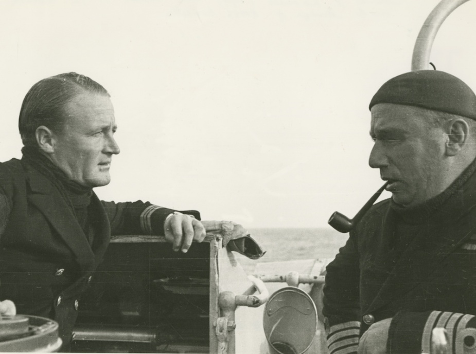 Vendetta's Commanding Officer Lieutenant Commander Rodney Rhoades, RAN confers with his flotilla leader, Captain HML Waller, DSO, RAN, during a lull in operations