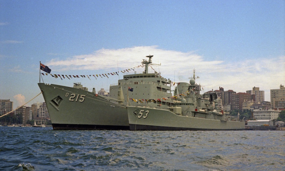 HMAS Torrens nested alongside Stalwart at the EMS mooring. Both ships are dressed overall. (John Jeremy collection)
