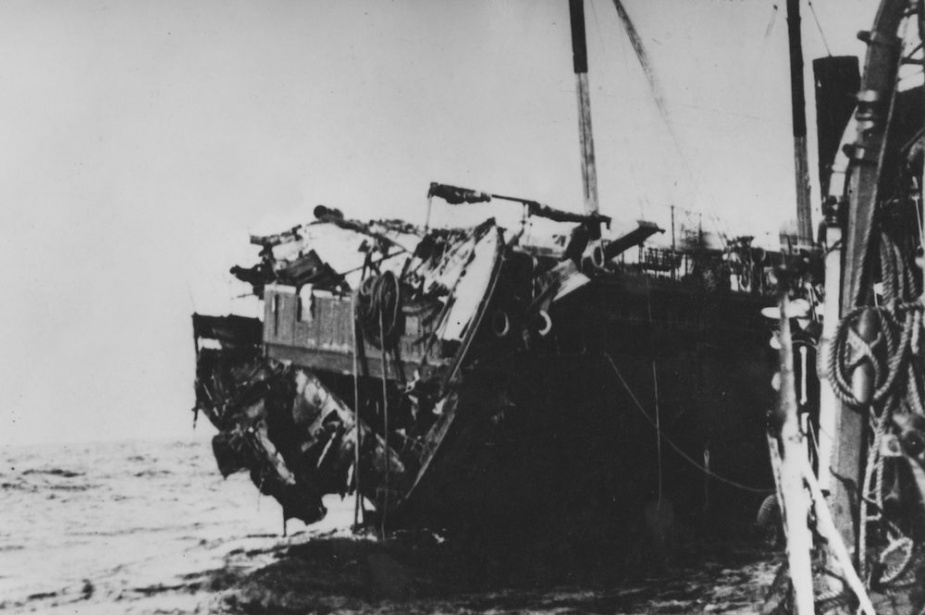 Parramatta alongside the torpedoed transport, Orione. 