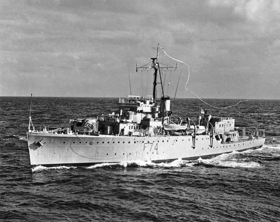 Swan flying her paying-off pennant prior to decommissioning in 1962.