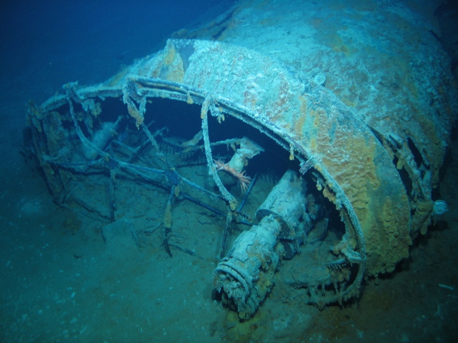 The aft funnel lying in the debris field with the two stove pipes seen in the preceding image clearly visible.