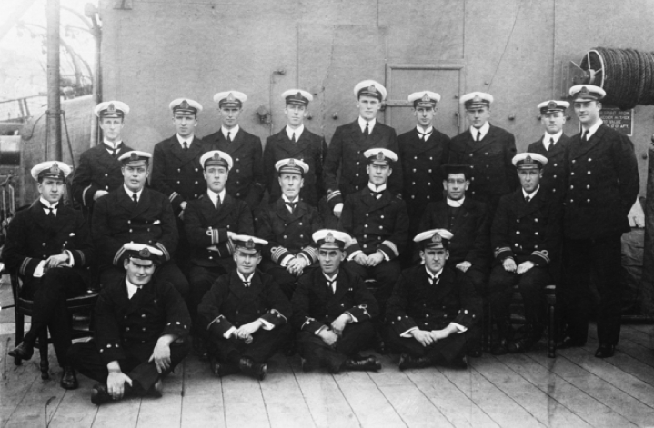 Group portrait of officers from the RAN light cruiser HMAS Sydney. The ship was on her way to the Atlantic after destroying the German raider SMS Emden at Cocos Island on 9 November 1914. Back row, left to right: Assistant Paymaster Eric Kingsford-Smith; Engineer Lieutenant Cleon Dennis; Sub Lieutenant James MC Johnstone; Artificer Engineer GA Hutchinson; Lieutenant Basil Owen Bell-Salter; Lieutenant Frederick L Cavaye; Lieutenant Rupert Clare Garsia; Dr Arthur Charles Robert Todd; Gunner Lieutenant Denis E