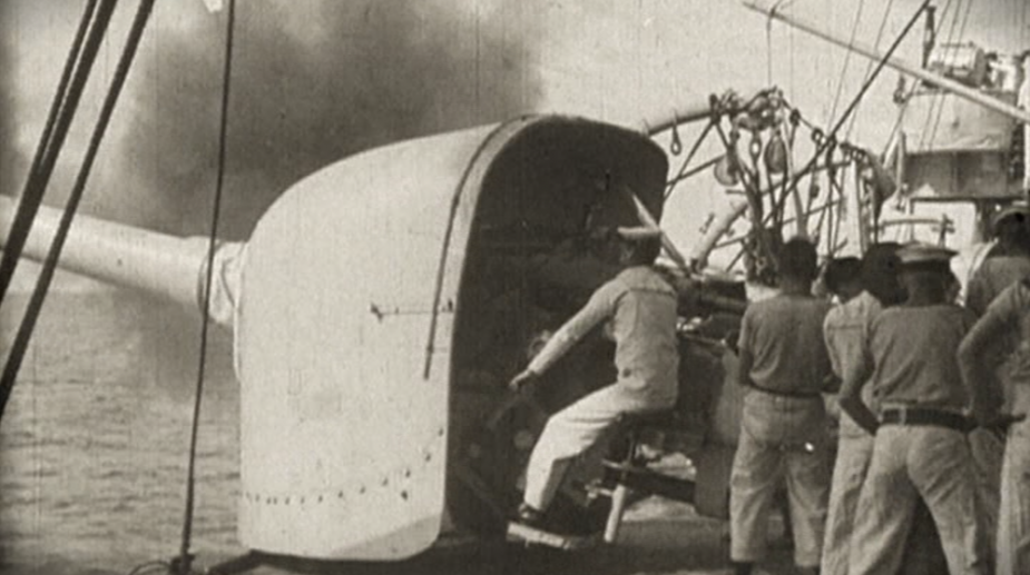 Gunners onboard Sydney serving one of her 6-inch guns 