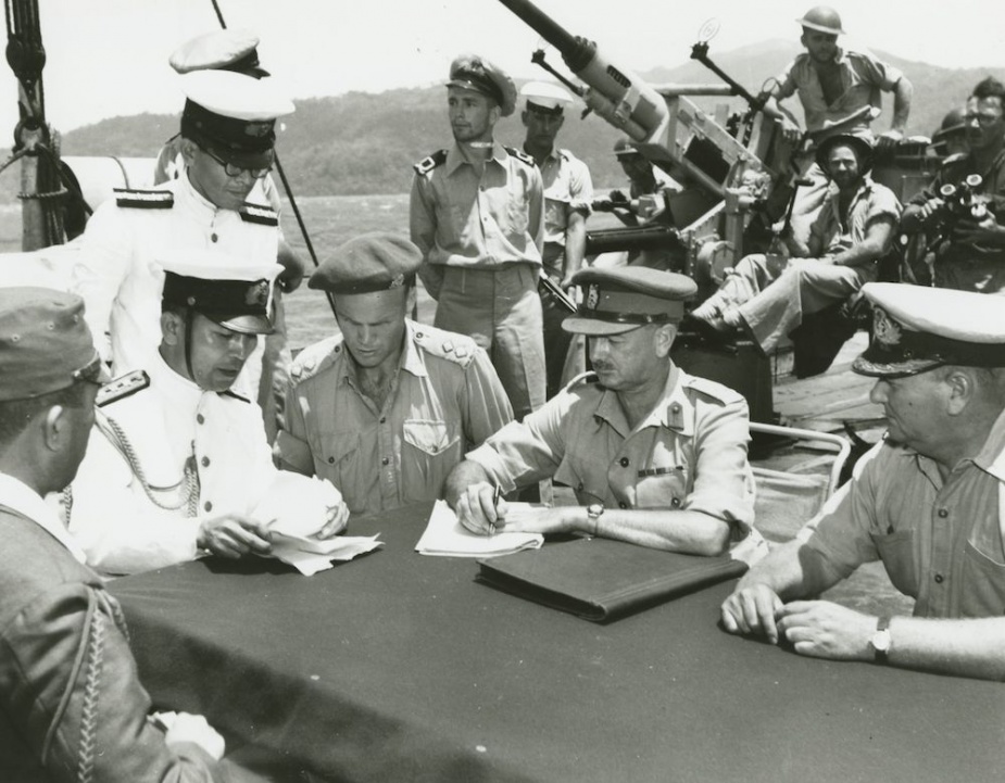 Per-surrender discussions onboard HMAS Vendetta off Rabaul, 4 September 1945. Representatives include Colonel Takahasi, Imperial Japanese Army, and Captain Sanagi, Japanese Navy, with Brigadier Sheehan and Commander Morris, RAN, Commanding Officer HMAS Ballarat.