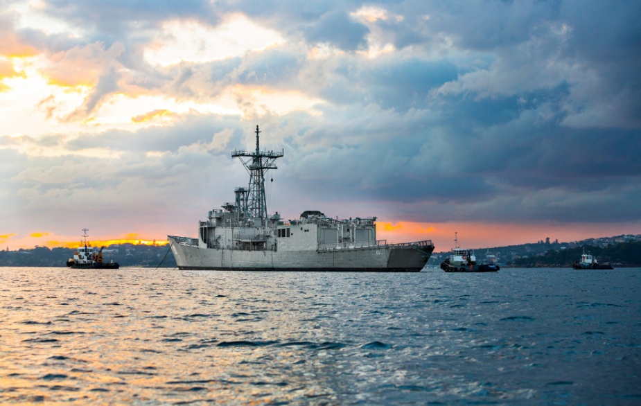 The former HMAS Sydney (IV) is moved for the last time from Garden Island, Sydney, to Western Australia, where the ship will be recycled by Australian company Birdon Pty Ltd. Sailors from HMAS Canberra, under the supervision of the National Port Service Organisation, crewed the decommissioned frigate for her final voyage out through Sydney Harbour on 18 May 2017. (LSIS Tom Gibson)