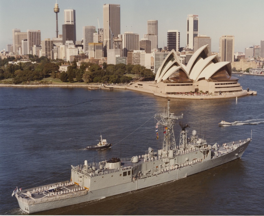 HMAS Sydney passes the Sydney Opera House on her way into Sydney Harbour.