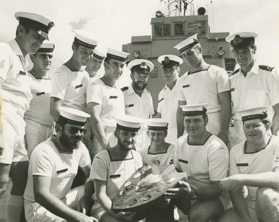 Wewak's ship's company with the LCH Proficiency Shield, March 1979. Back row; POCOXN Chris Edes, ABMTP John McMahon, ABUW Graham Dennien, ABRO John Breen, LSMTP Brenton Rule, LEUT Bernie Neville (CO), CPOMTP Bob Price, ABMTP Mick Bulger, SBLT Stewart Dietrich (XO). Front row; ABMTP Leon Auciello, ABFC Charlie Pigram, LSCK Lindsay Smith, ABQMG Dene Travis, LSETC David Lutton.