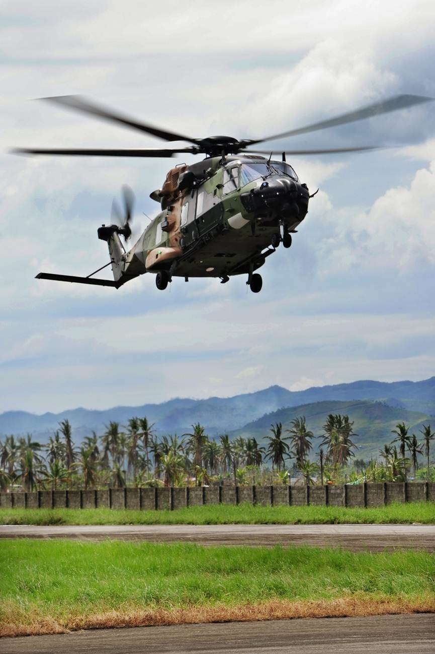 HMAS Tobruk’s embarked MRH-90 helicopter arrives at Ormoc Airport, Philippines, during Operation PHILIPPINES ASSIST.