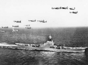 Sea Furies and Fireflies in formation over HMAS Sydney.